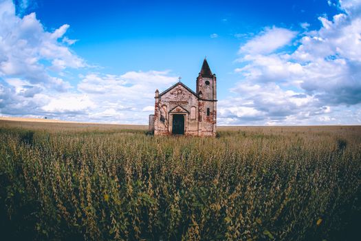 Lonely church in field in countryside