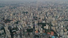 Tall buildings in misty district of megapolis