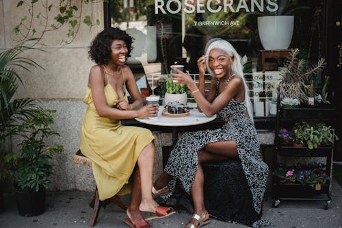 Women Having Coffee in Sidewalk Cafe