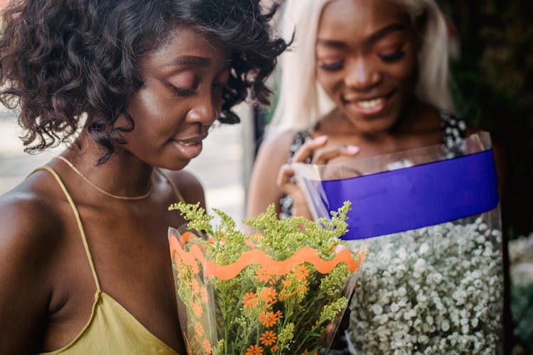 Beautiful Women Friends Shopping For Flowers Together 