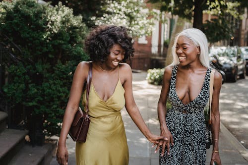 Women Laughing Together in City