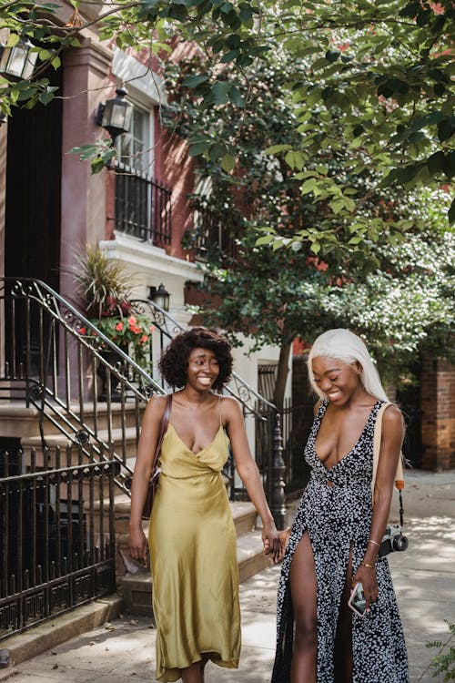 Women Laughing Together in City Street