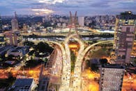 Illuminated highway in modern city in evening