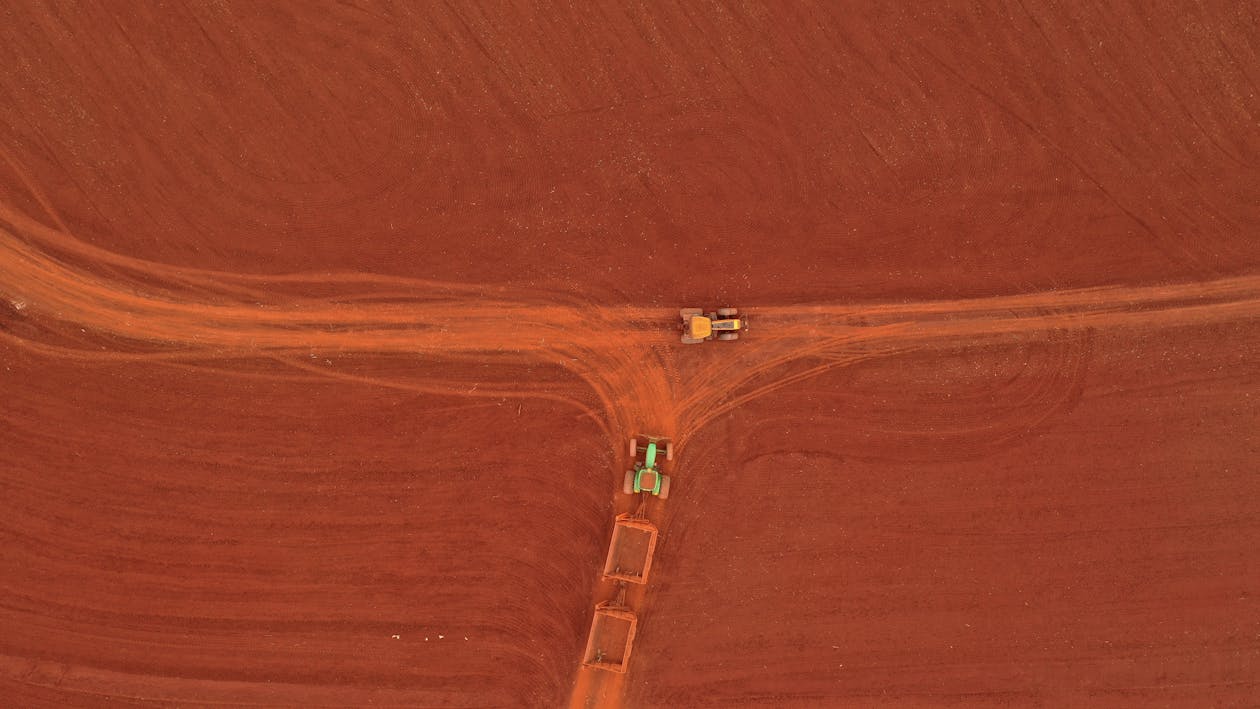 tractors-on-roadway-in-dry-field