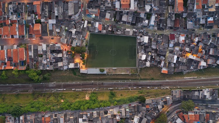 Cityscape Of Residential District With Football Field