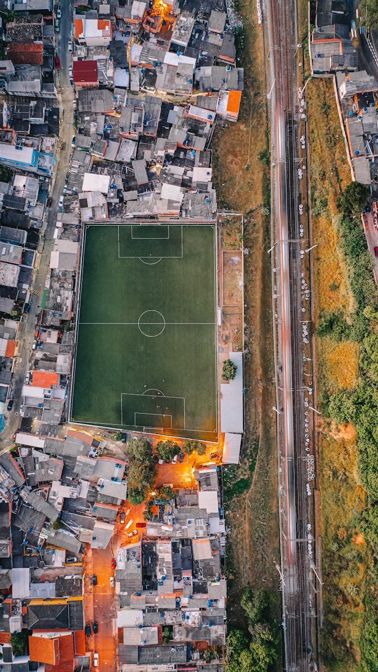 Football Field Located In City District With Residential Buildings