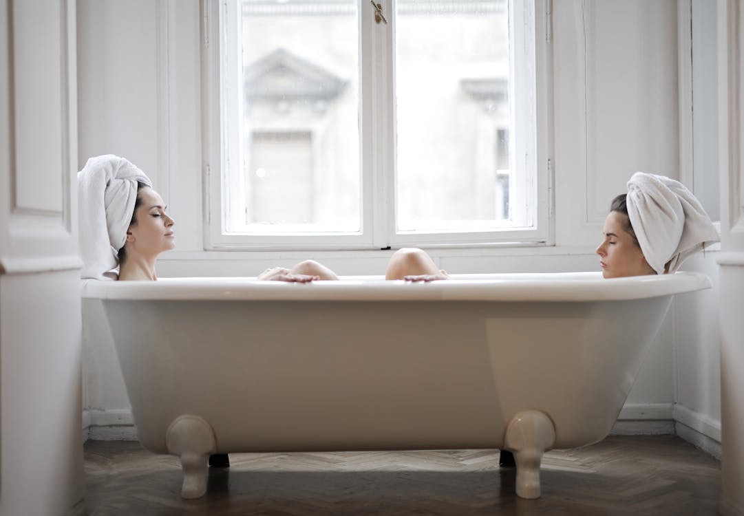 Calm Women Taking Bath Relaxing Together
