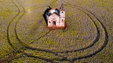Old church on grassy meadow