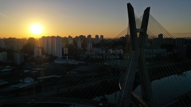 Octavio Frias de Oliveira bridge with concrete mast above river located in Sao Paulo at sundown