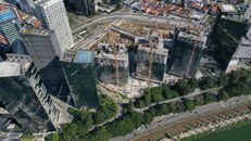 High cranes working on construction of modern towers