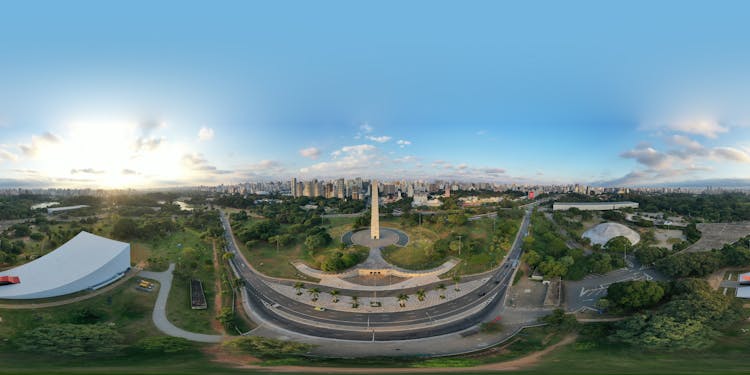 City Park With Tall Spire Among Trees