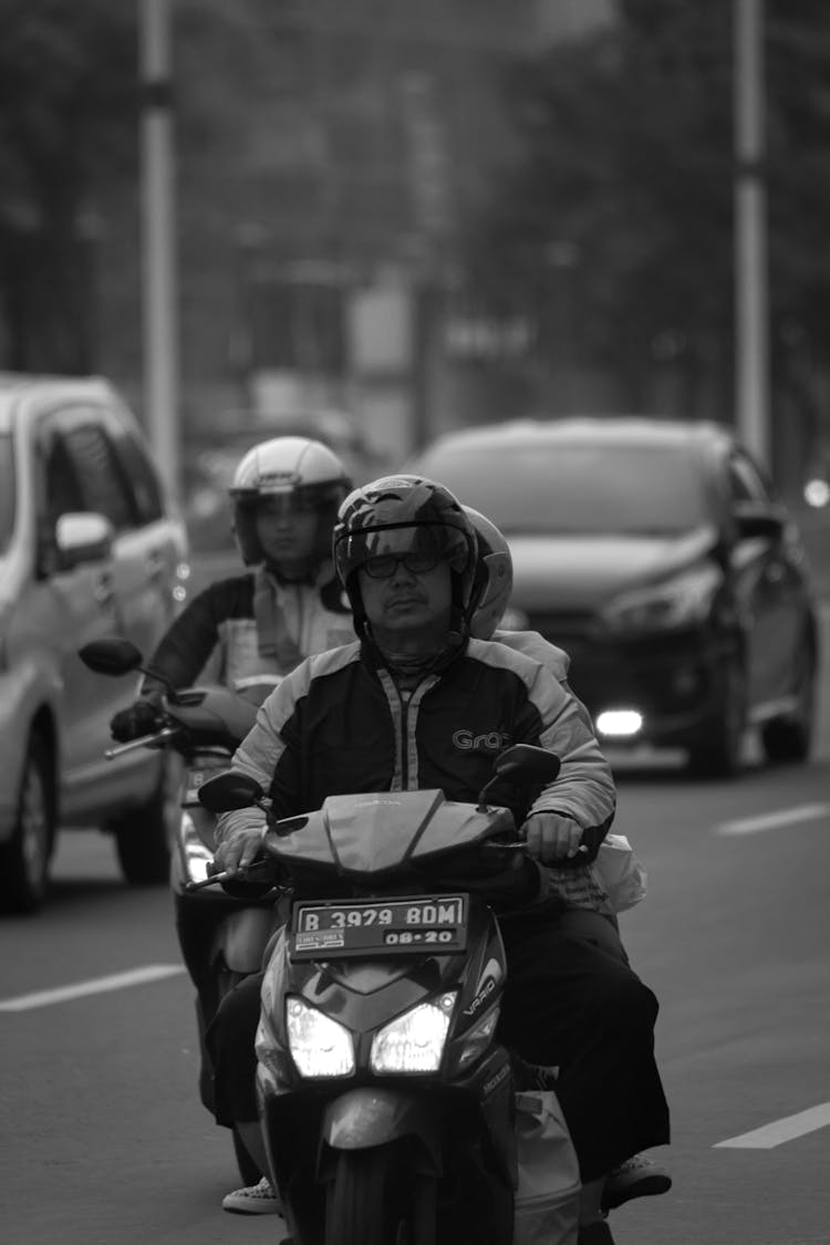 Men On Motorcycles Stuck In Traffic