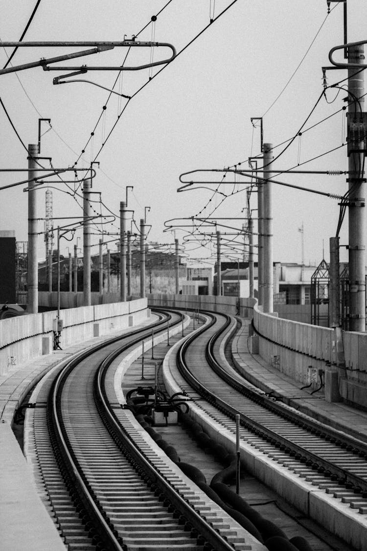 Empty Railway Train Tracks In Black And White