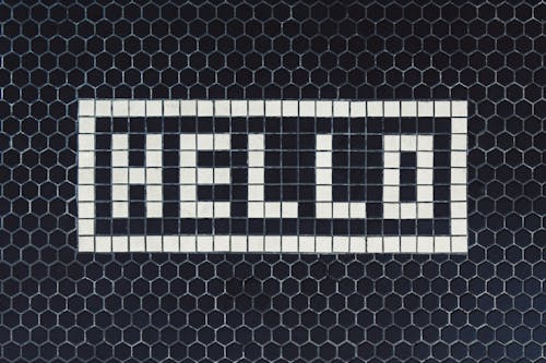 A Word "Hello" Made from Tiles on the Wall 