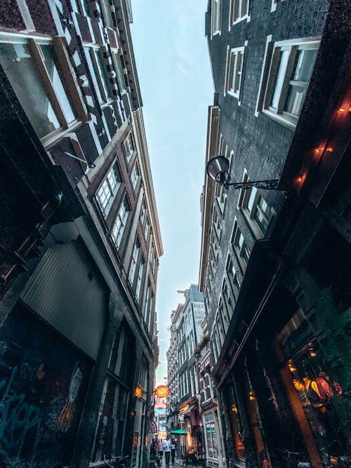 Low Angle Shot of a Narrow Alley between Buildings in City
