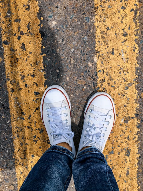 A Person Wearing White Shoes