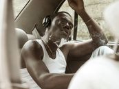 Woman in White Tank Top Sitting Inside Car