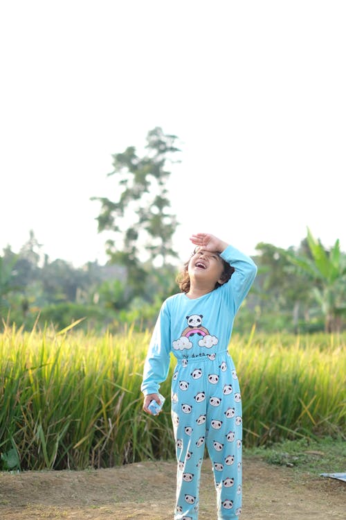 A Girl Wearing Blue Pajamas