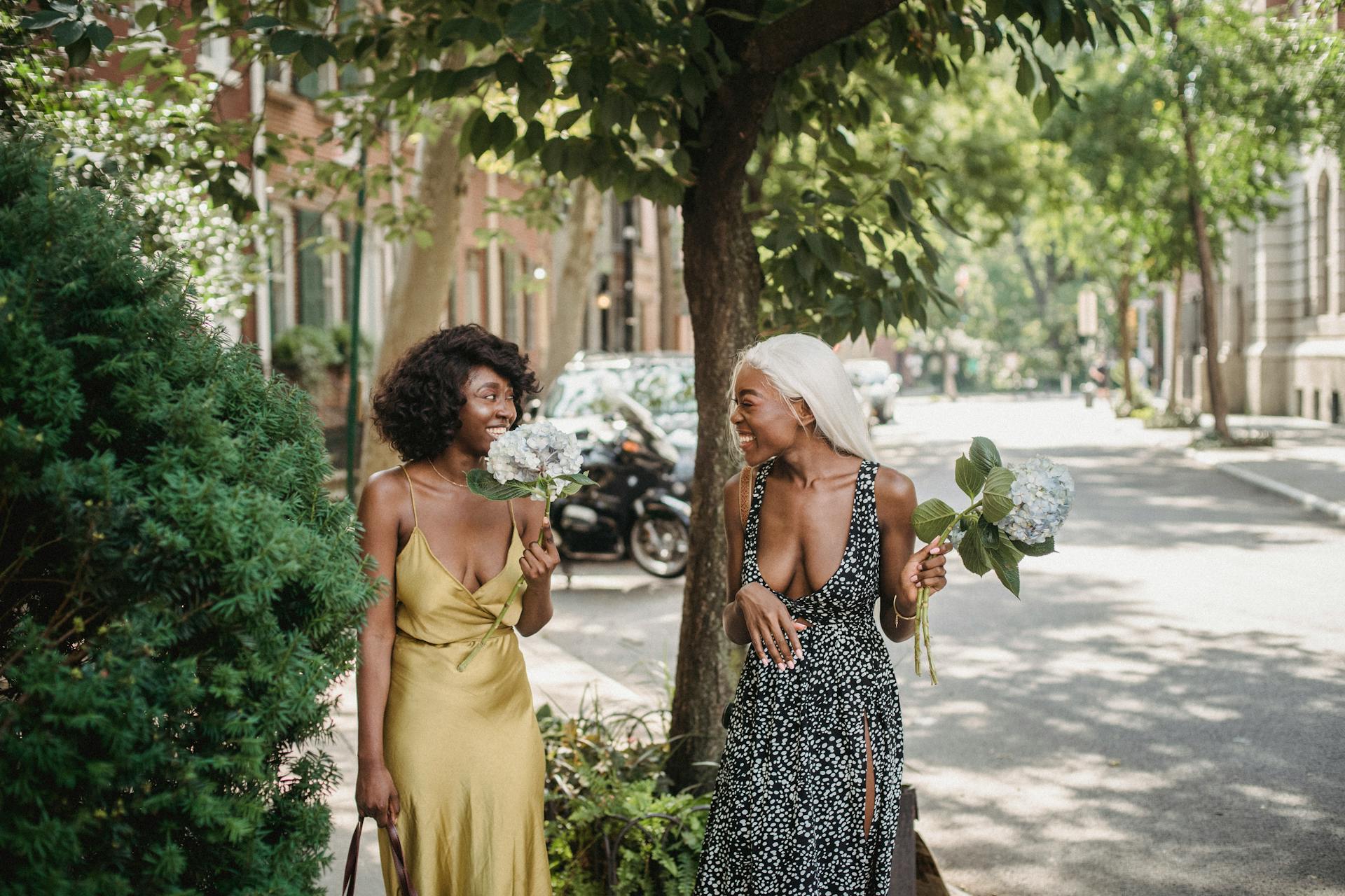 Women Holding Bouquets of Hydrangea Flowers