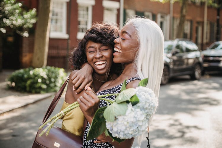 Happy Friends Hugging Each Other