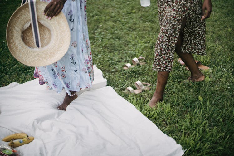 Women Legs Walking On Grass 