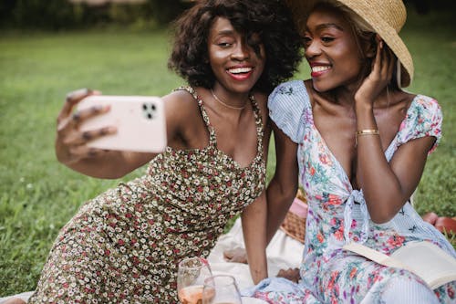 Free Women in Floral Dress Taking Selfie  Stock Photo