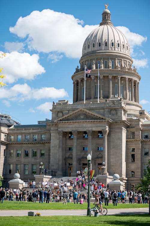 People gathering near majestic Idaho State Capitol palace