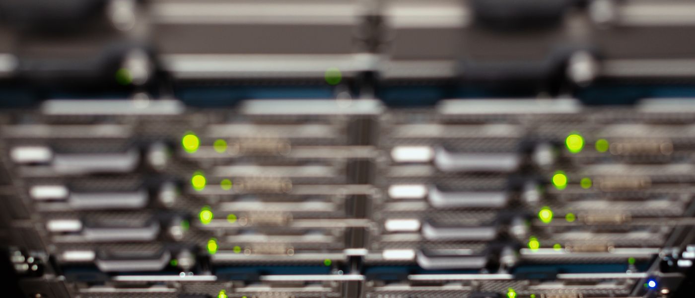 IT professional overseeing a complex server migration in a modern data center, illustrating a VMware to Hyper-V infrastructure revamp.