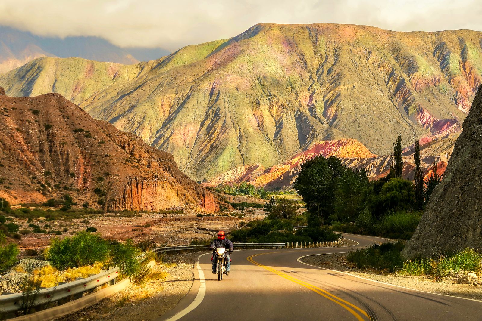 Motorcyclist on a winding mountain road
