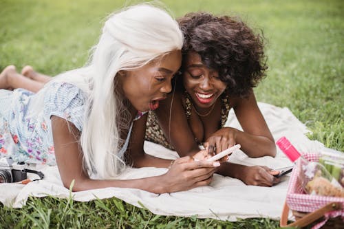 Smiling Women Looking at Cellphone