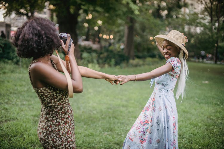 Happy Friends Wearing Floral Dresses