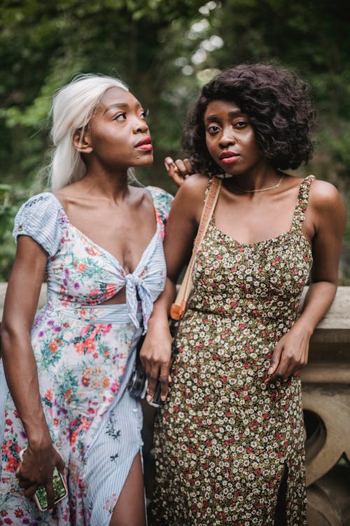 Beautiful Women in Floral Dresses Posing Together