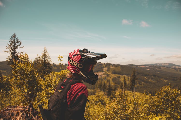 Person Wearing Red And Black Helmet