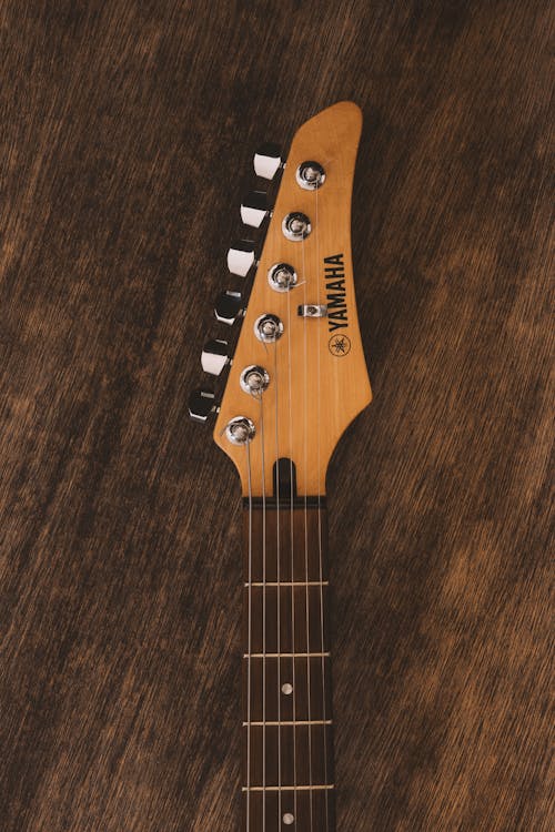 Free Electric Guitar on Wooden Surface Stock Photo