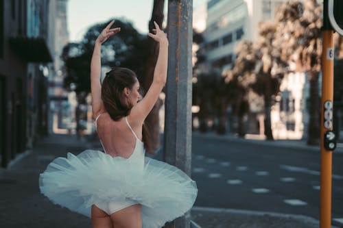 A Female Ballet Dancer Posing in the Street