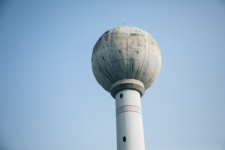 Old Water Tower Under Sky In City