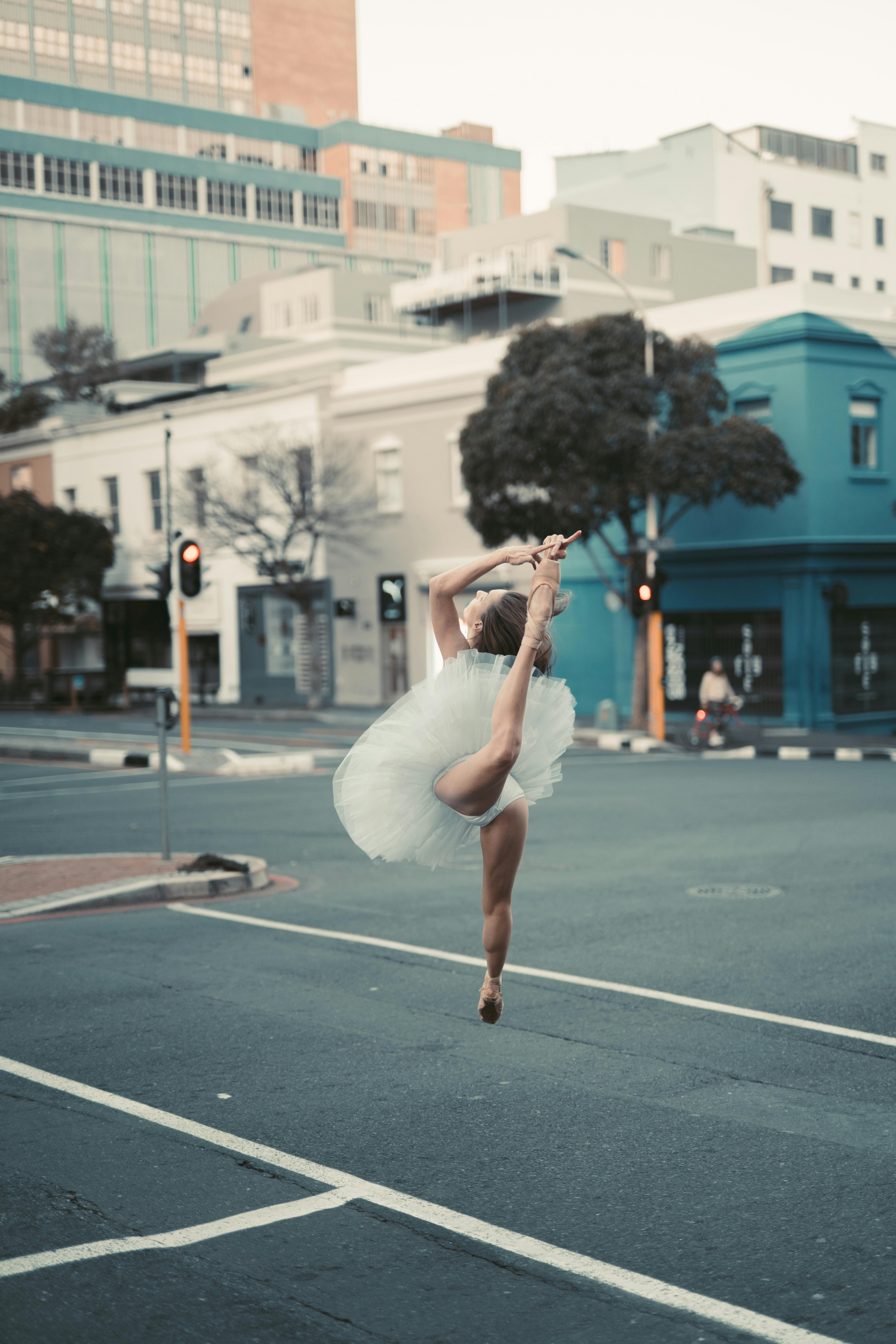 woman in white dress running on road