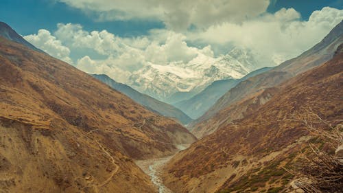 Brown Mountains Under Cloudy Sky