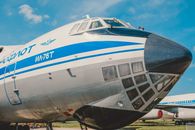Close-up of IL-76T cargo aircraft displaying iconic Aeroflot branding at a sunny airfield.