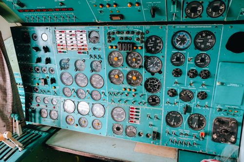 Free Detailed view of a vintage aircraft control panel with dials and gauges. Stock Photo