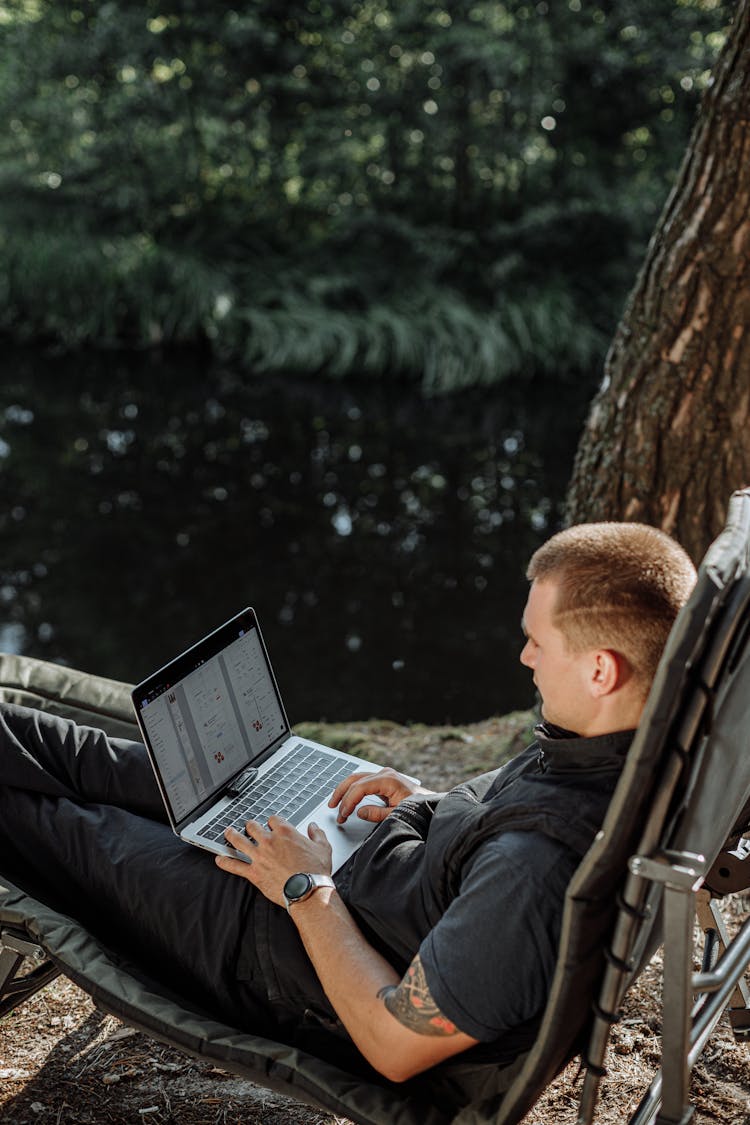 A Man Using Laptop