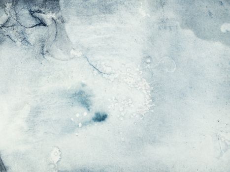 Close-up of a textured icy surface with cool winter hues, ideal for backgrounds and designs.