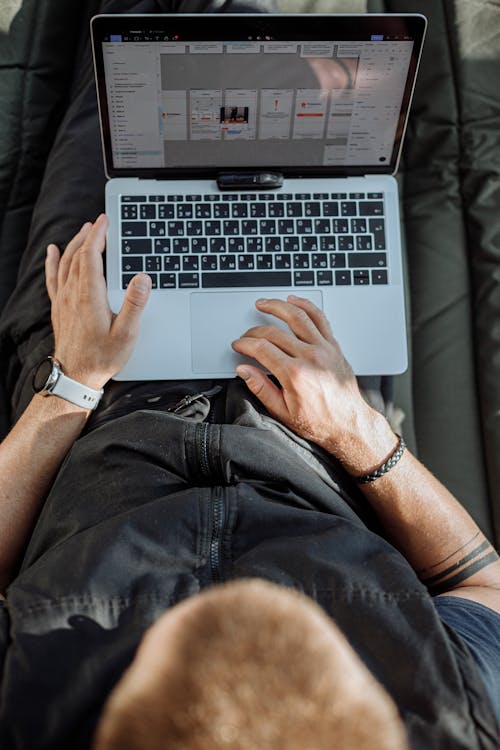 A Person Working on His Laptop