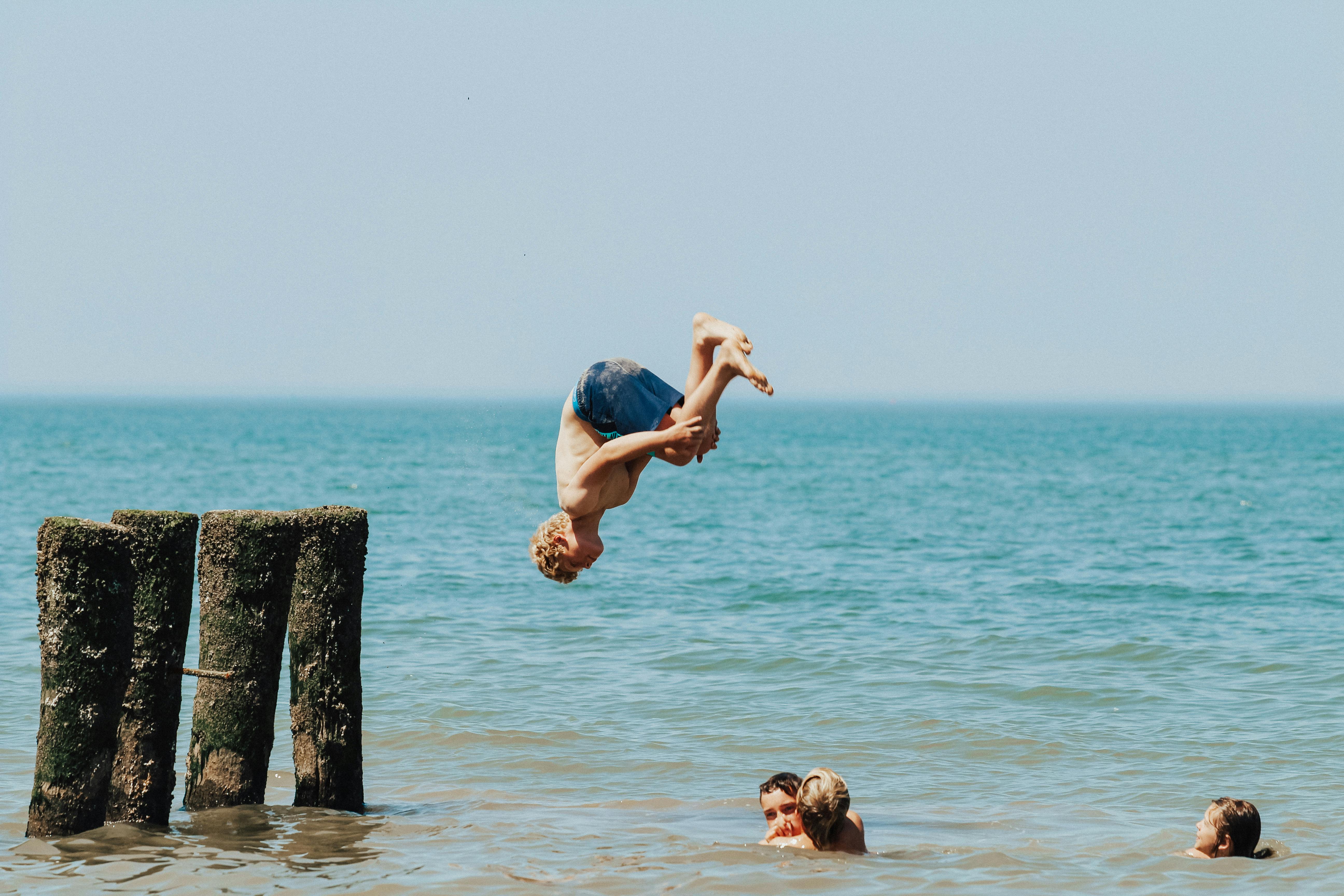 Man Diving Head First into Water · Free Stock Photo