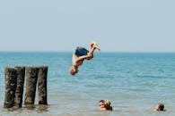 Man Diving Head First into Water