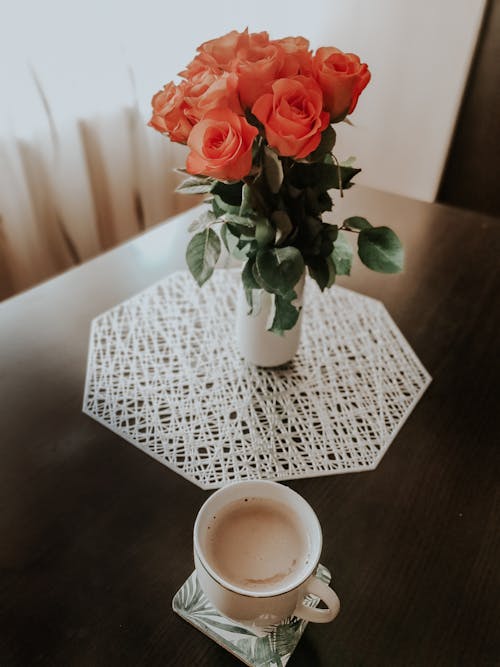 Roses in White Ceramic Vase