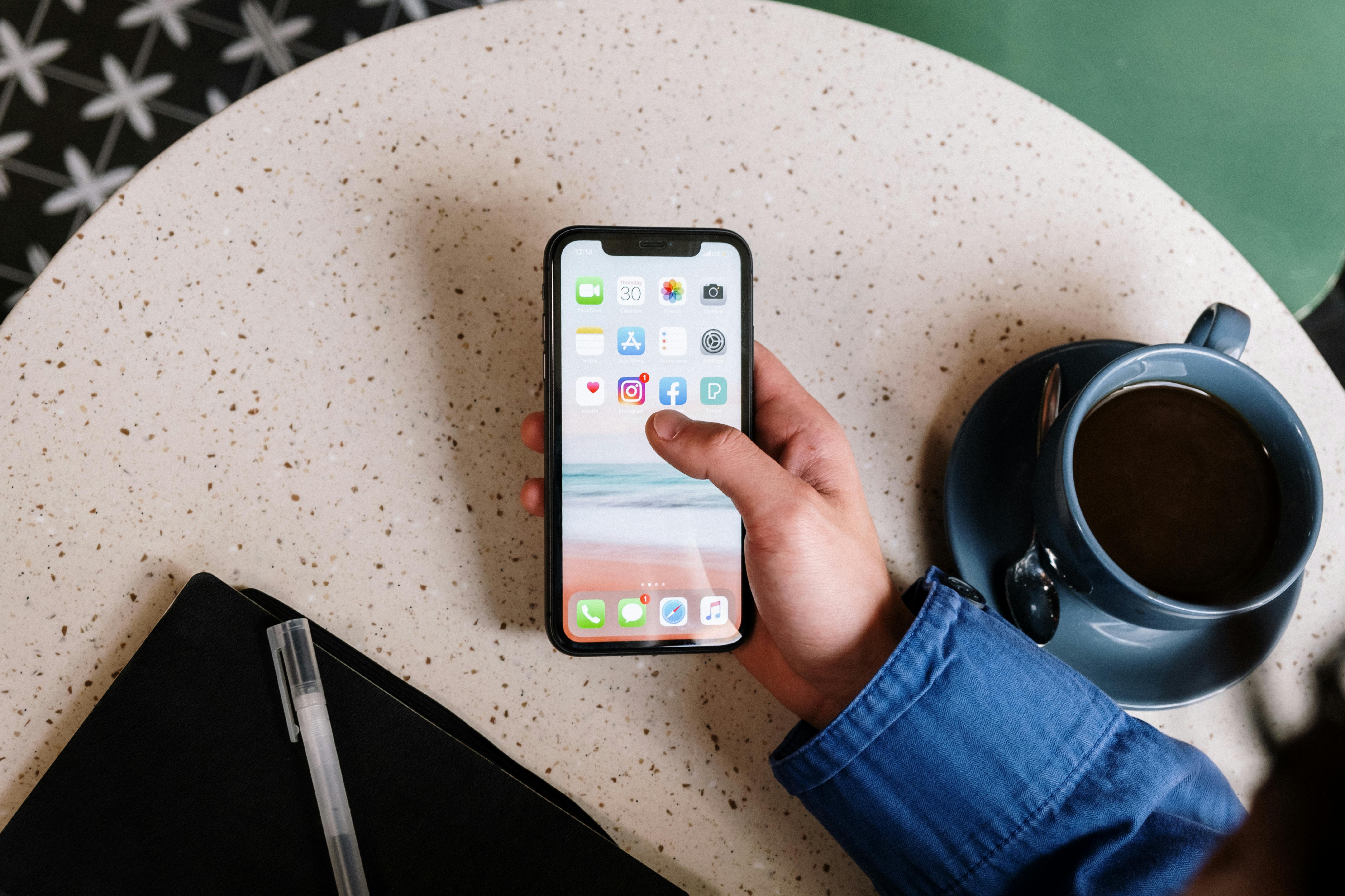 person holding black iphone