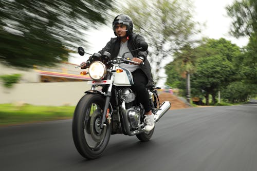 Free Man Riding a White Motorcycle Stock Photo