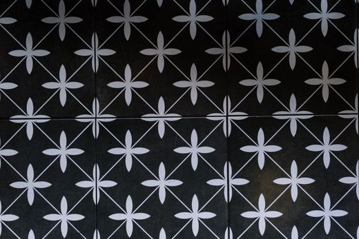 Repeating geometric tile pattern with floral motifs — photo by cottonbro studio on Pexels