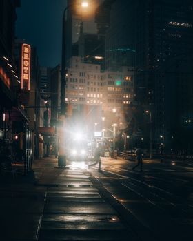 Captivating nighttime street scene in downtown Minneapolis featuring illuminated buildings and active pedestrians.